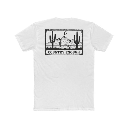White t-shirt with graphic of mountains, cacti, and moon and star over a desert landscape with words country enough #white