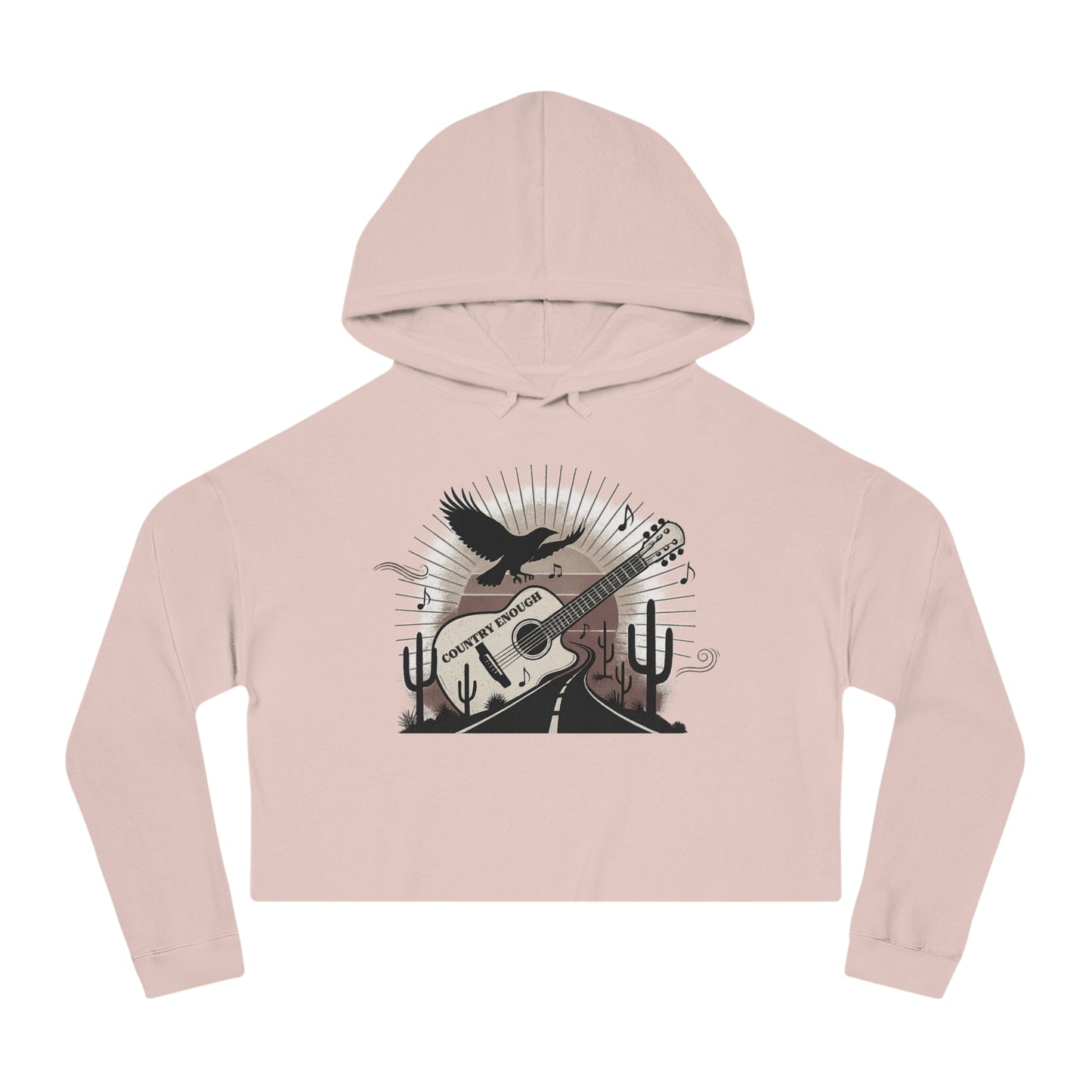 Pale Pink crop hoodie with a graphic of a guitar, a soaring desert bird, cactus silhouettes, and a sunset over a winding road #palepink