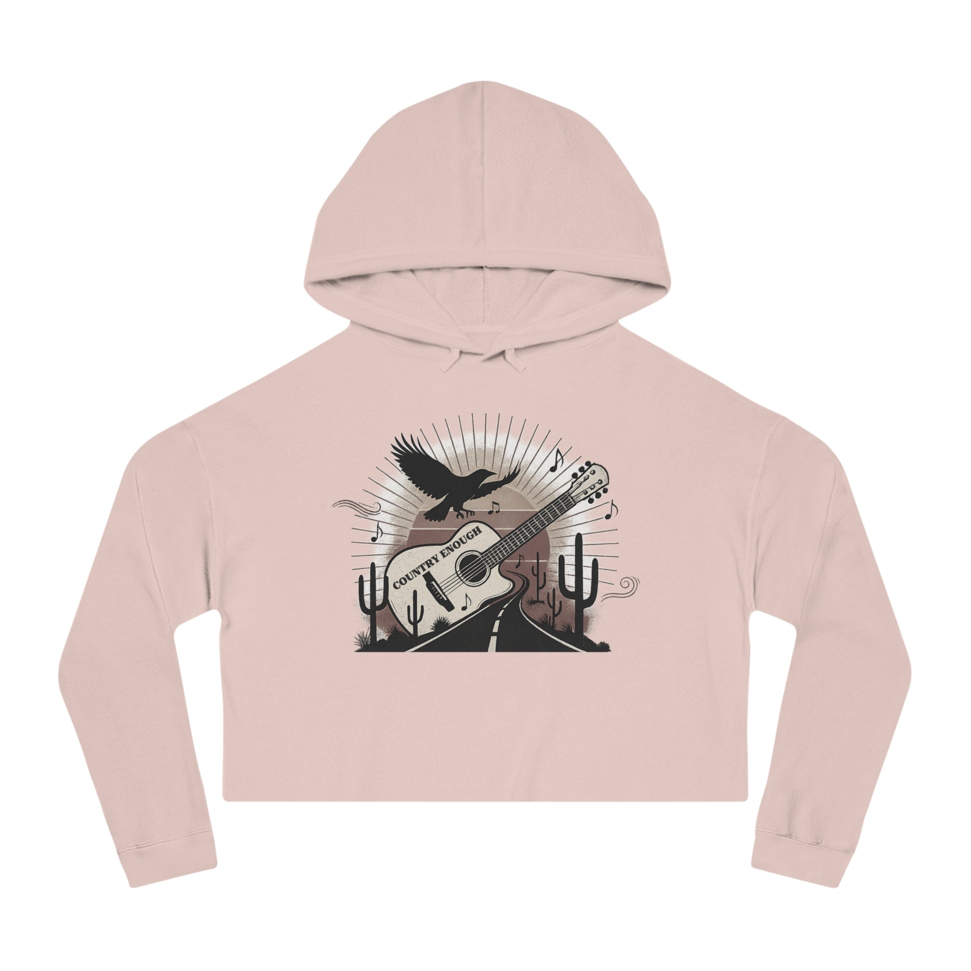 Pale Pink crop hoodie with a graphic of a guitar, a soaring desert bird, cactus silhouettes, and a sunset over a winding road #palepink