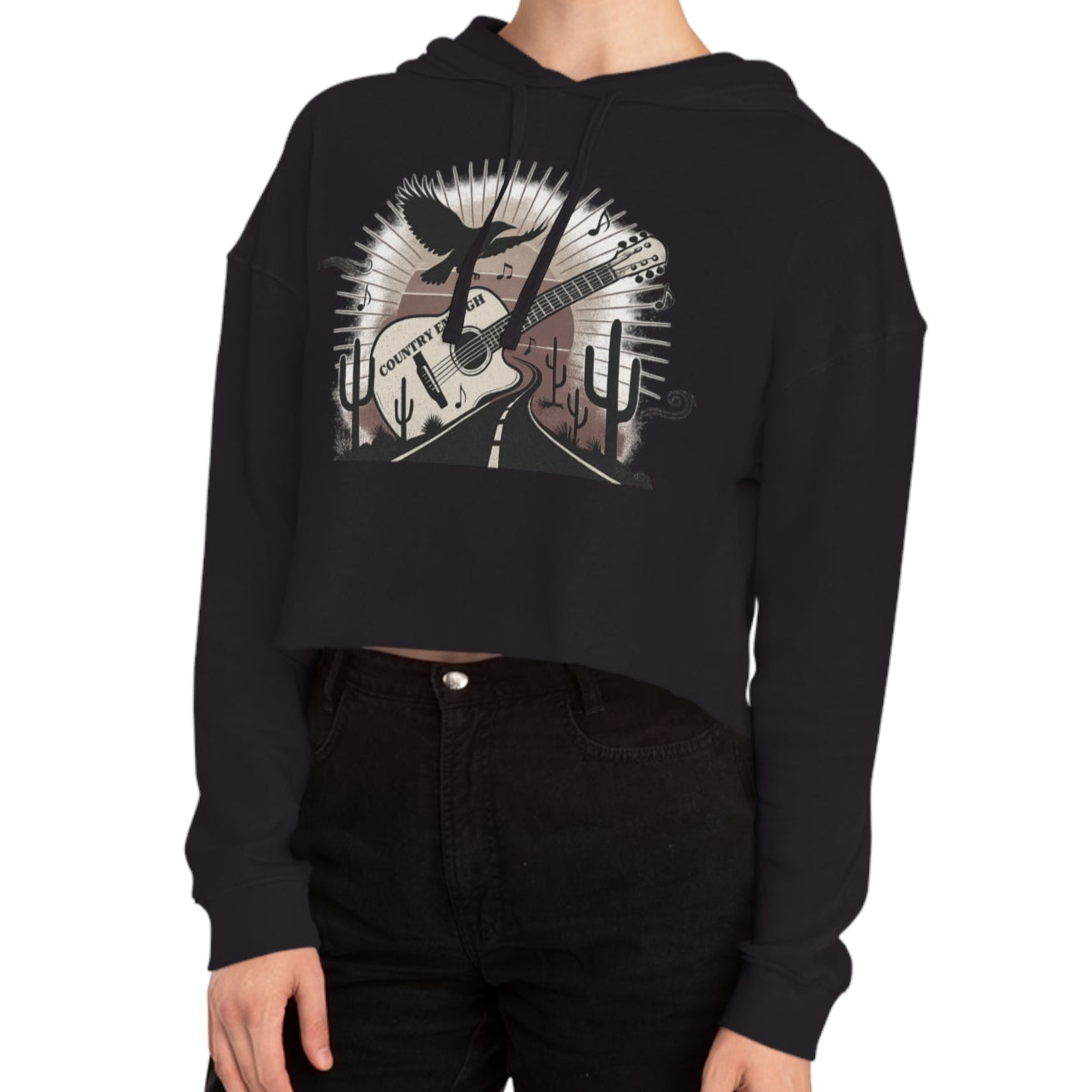 Black crop hoodie with a graphic of a guitar, a soaring desert bird, cactus silhouettes, and a sunset over a winding road #black