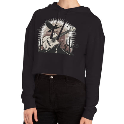 Black crop hoodie with a graphic of a guitar, a soaring desert bird, cactus silhouettes, and a sunset over a winding road #black