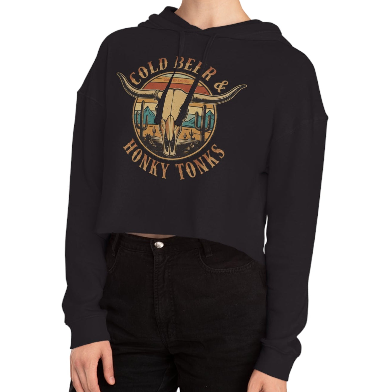 Black crop hoodie with graphic of longhorn, cacti, and mountains over a retro background with words cold beer and honky tonks #black