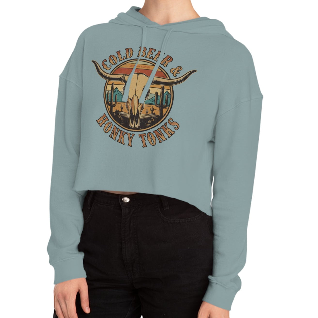 Mineral crop hoodie with graphic of longhorn, cacti, and mountains over a retro background with words cold beer and honky tonks #mineral
