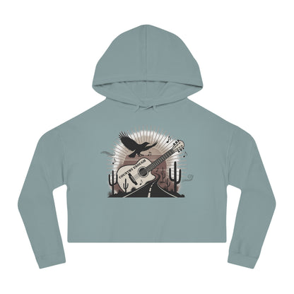 Mineral crop hoodie with a graphic of a guitar, a soaring desert bird, cactus silhouettes, and a sunset over a winding road #mineral