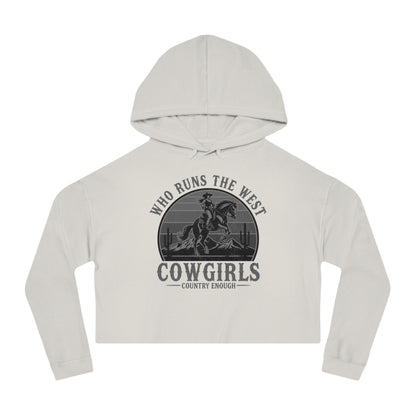 Bone crop hoodie with graphic of a cowgirls on a bucking horse, cacti, mountains, and the words who runs the west cowgirls #bone