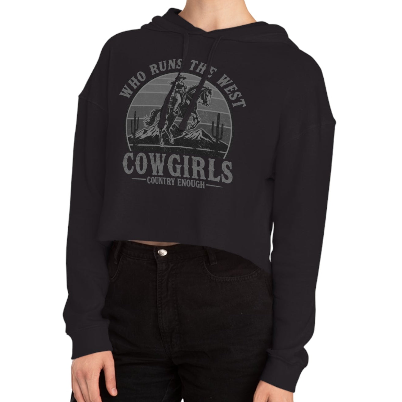 Black crop hoodie with graphic of a cowgirls on a bucking horse, cacti, mountains, and the words who runs the west cowgirls #black