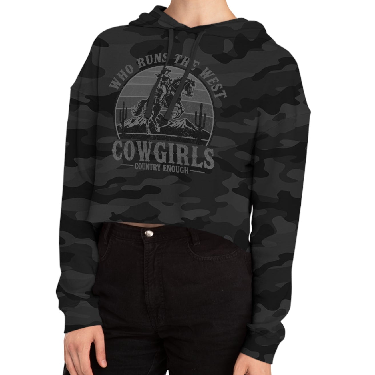 Black Camo crop hoodie with graphic of a cowgirls on a bucking horse, cacti, mountains, and the words who runs the west cowgirls #blackcamo