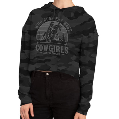 Black Camo crop hoodie with graphic of a cowgirls on a bucking horse, cacti, mountains, and the words who runs the west cowgirls #blackcamo