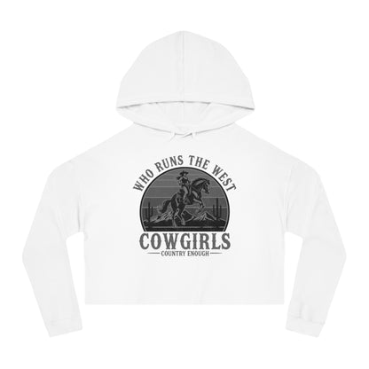 White crop hoodie with graphic of a cowgirls on a bucking horse, cacti, mountains, and the words who runs the west cowgirls #white