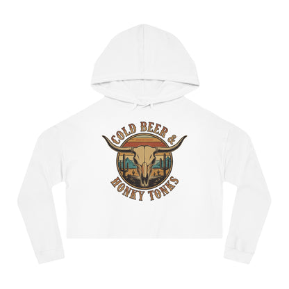 White crop hoodie with graphic of longhorn, cacti, and mountains over a retro background with words cold beer and honky tonks #white