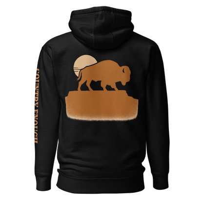 Black hoodie with graphic of bison atop a plateau, the sun behind, and the words country enough #black