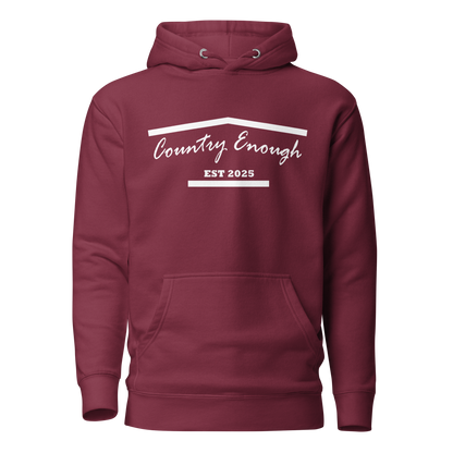 Maroon hoodie with graphic of the outline of a house and the words country enough est 2025 #maroon