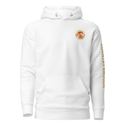 White hoodie with circular graphic of a cowboy, horse, campfire, sun, cacti and desert landscape with words country enough #white