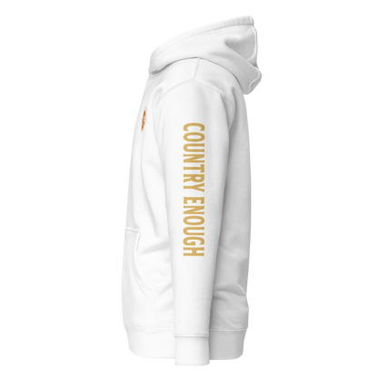 White hoodie with circular graphic of a cowboy, horse, campfire, sun, cacti and desert landscape with words country enough #white