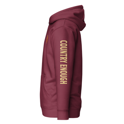 Maroon hoodie with circular graphic of a cowboy, horse, campfire, sun, cacti and desert landscape with words country enough #maroon