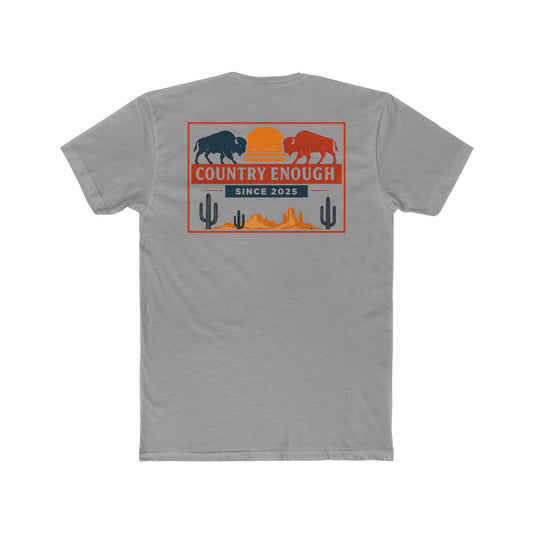 Gray t-shirt with graphic of mirrored bison in red and blue, sun, desert landscape, cacti, and the words country enough since 2025 #gray