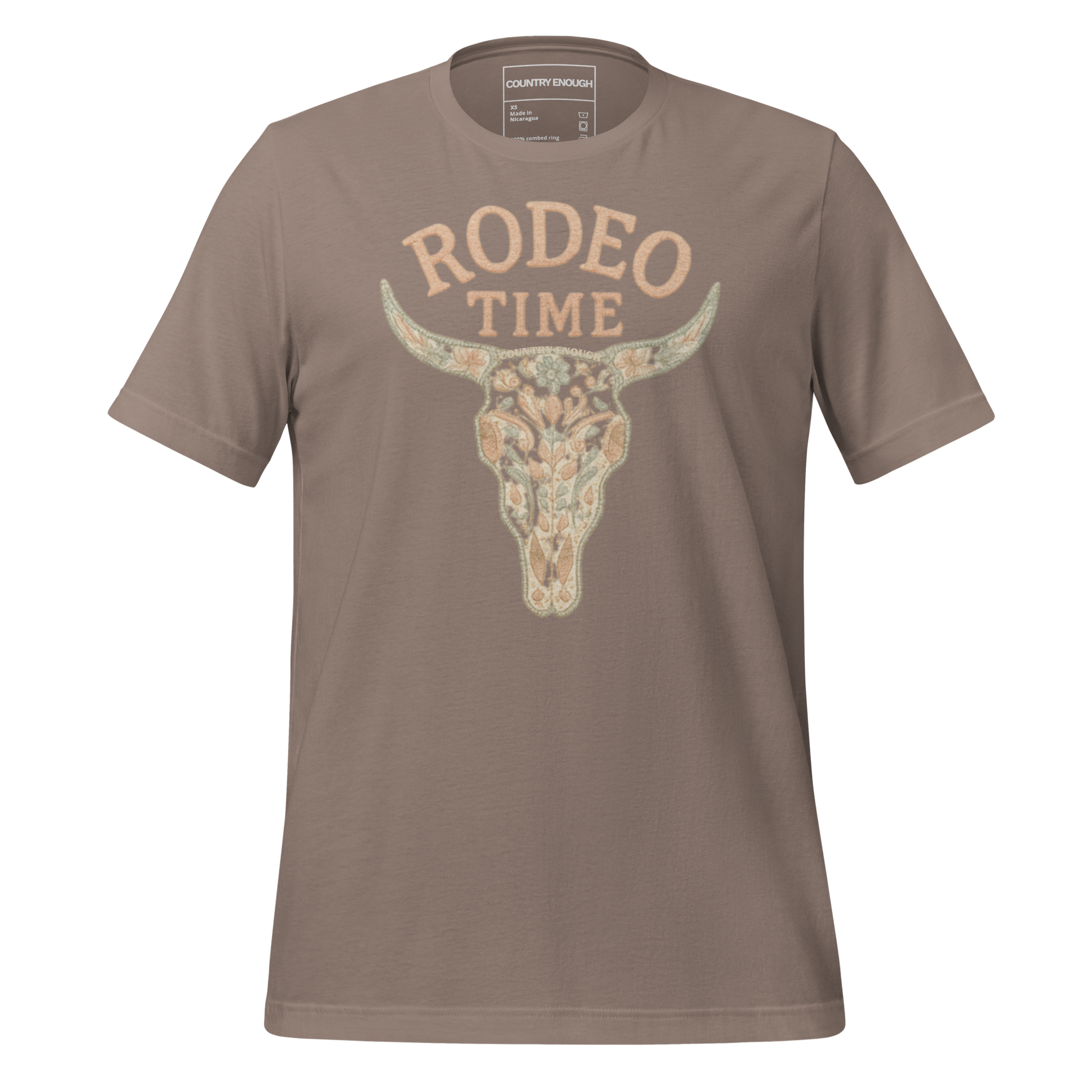 Pebble t-shirt with graphic of a bull skull filled with flower pattern and the words rodeo time above #pebble