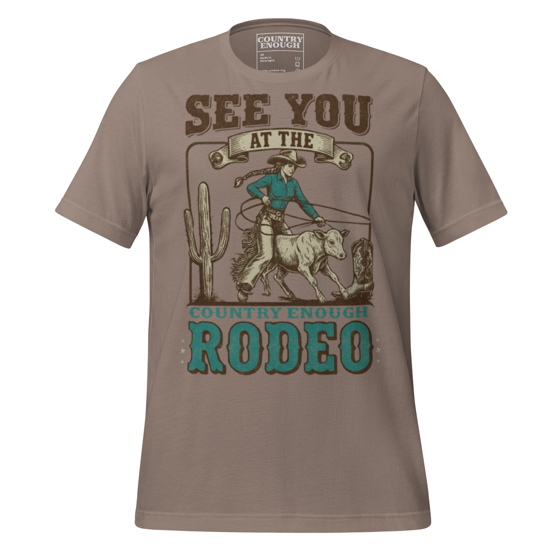 Pebble t-shirt with graphic of cowgirl, calf, cactus, cowboy boot, and words see you at the rodeo #pebble