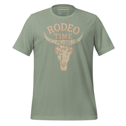 Sage t-shirt with graphic of a bull skull filled with flower pattern and the words rodeo time above #sage