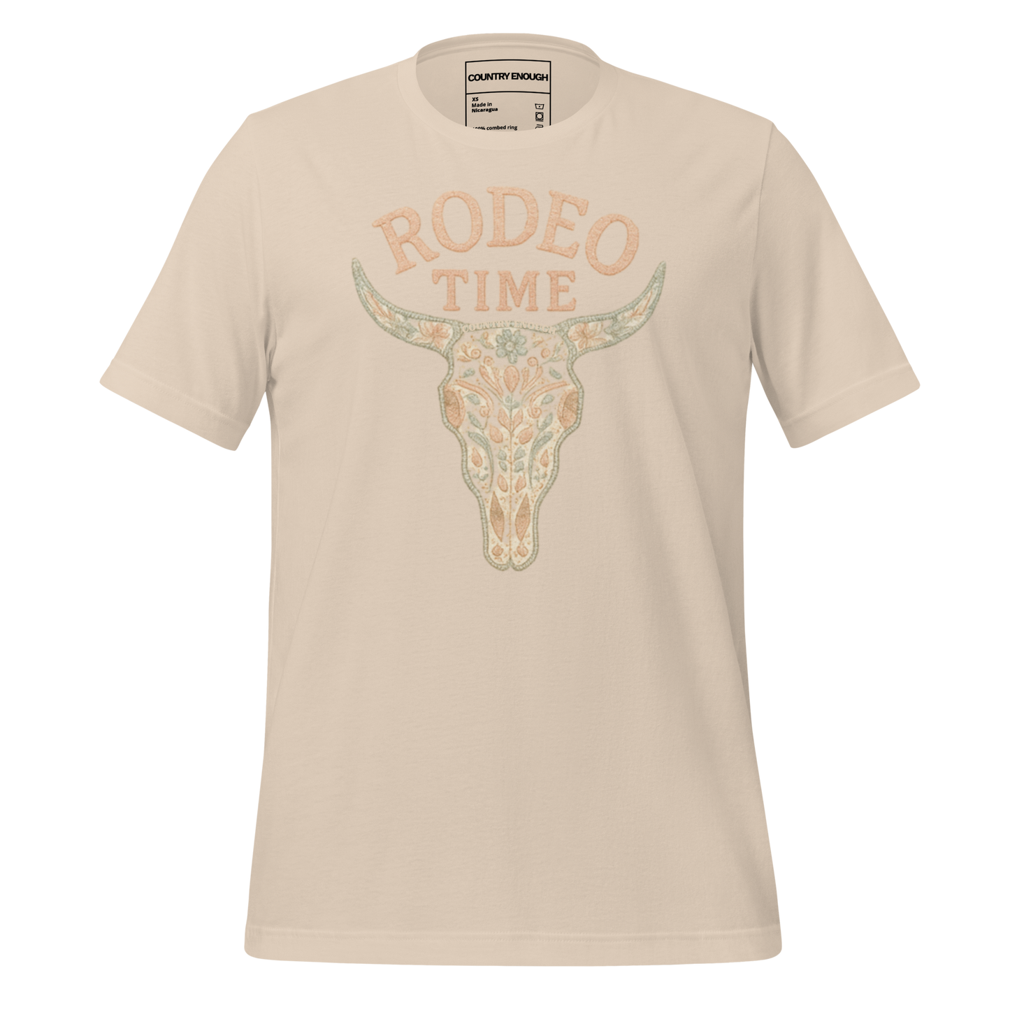 Cream t-shirt with graphic of a bull skull filled with flower pattern and the words rodeo time above #cream