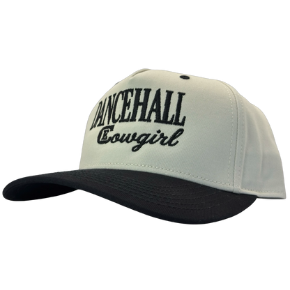 legacy heritage snapback hat with the words dancehall cowgirl and graphic of CE logo #black