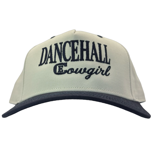 legacy heritage snapback hat with the words dancehall cowgirl and graphic of CE logo #navy