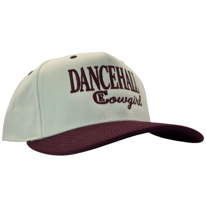 legacy heritage snapback hat with the words dancehall cowgirl and graphic of CE logo #wine
