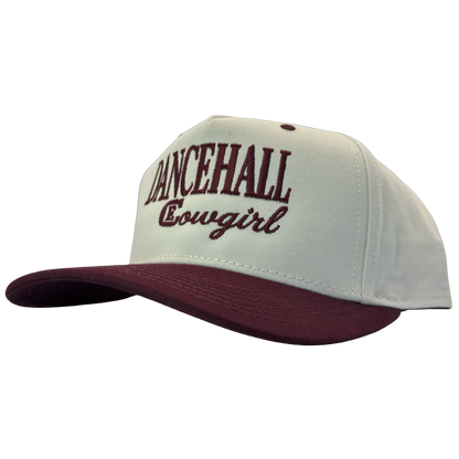 legacy heritage snapback hat with the words dancehall cowgirl and graphic of CE logo #wine