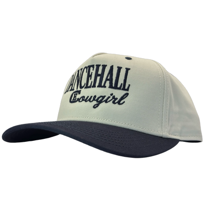legacy heritage snapback hat with the words dancehall cowgirl and graphic of CE logo #navy