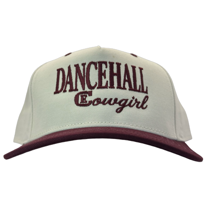legacy heritage snapback hat with the words dancehall cowgirl and graphic of CE logo #wine