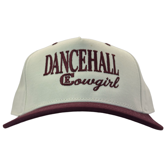 legacy heritage snapback hat with the words dancehall cowgirl and graphic of CE logo #wine