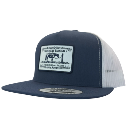 Yupoong 6006 flat bill snapback with a patch that contains a graphic of a horse and says the words country enough steakhouse and saloon #navy/white