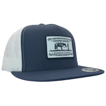 Yupoong 6006 flat bill snapback with a patch that contains a graphic of a horse and says the words country enough steakhouse and saloon #navy/white