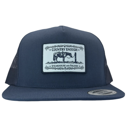 Yupoong 6006 flat bill snapback with a patch that contains a graphic of a horse and says the words country enough steakhouse and saloon #navy