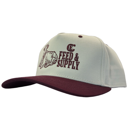 Legacy Heritage HTA snapback with graphic of a cow and the words feed & supply with CE logo #wine