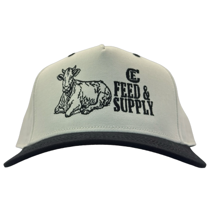 Legacy Heritage HTA snapback with graphic of a cow and the words feed & supply with CE logo #black