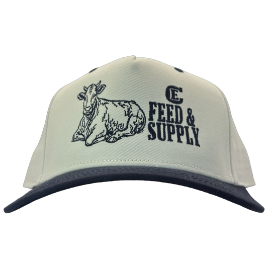 Legacy Heritage HTA snapback with graphic of a cow and the words feed & supply with CE logo #navy