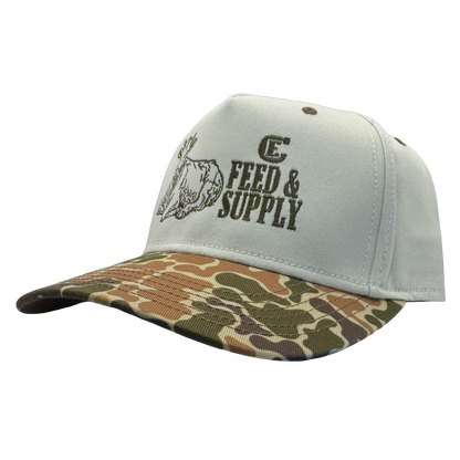 Legacy Heritage HTA snapback with graphic of a cow and the words feed & supply with CE logo #duckcamo