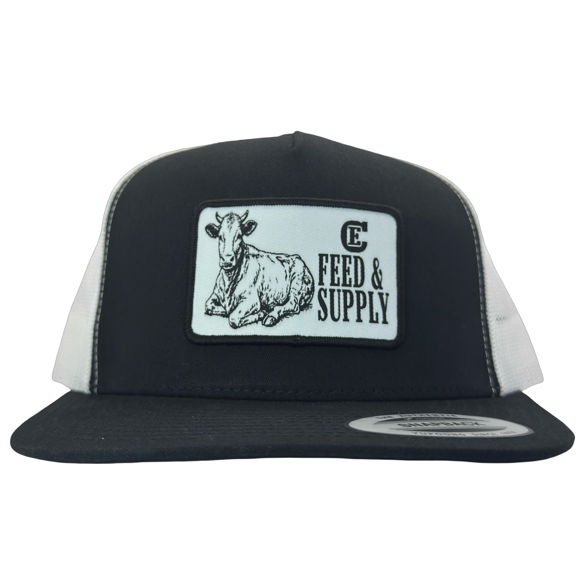Yupoong 6006 snapback hat with patch that contains graphic of a sitting cow, the words Feed & Supply, and the CE logo. #black/white