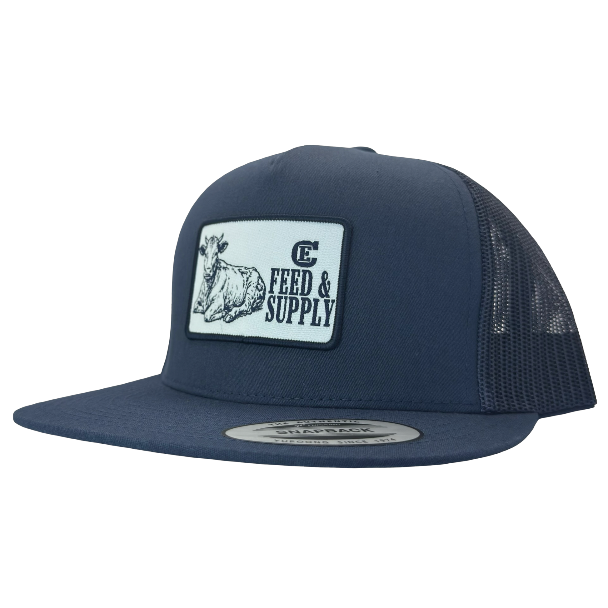Yupoong 6006 snapback hat with patch that contains graphic of a sitting cow, the words Feed & Supply, and the CE logo. #navy