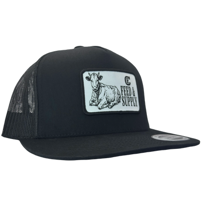 Yupoong 6006 snapback hat with patch that contains graphic of a sitting cow, the words Feed & Supply, and the CE logo. #black