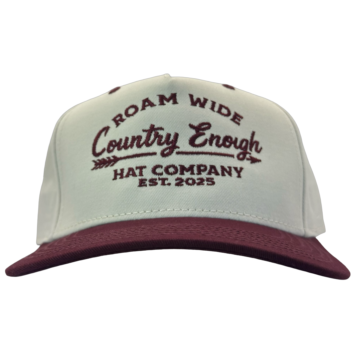 legacy heritage snapback with graphic of arrow and words roam wide, country enough hat company est. 2025 #wine