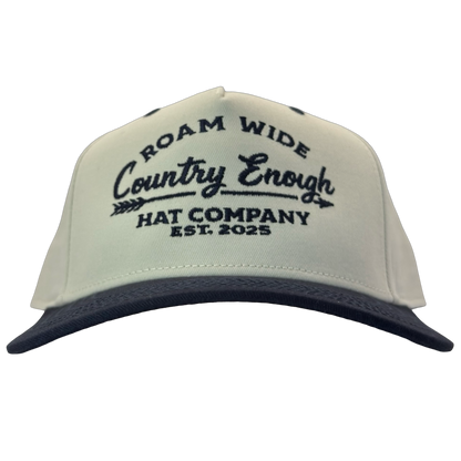 legacy heritage snapback with graphic of arrow and words roam wide, country enough hat company est. 2025 #navy