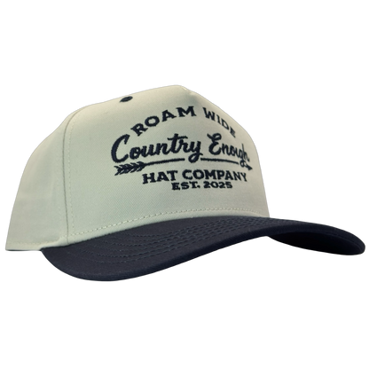 legacy heritage snapback with graphic of arrow and words roam wide, country enough hat company est. 2025 #navy