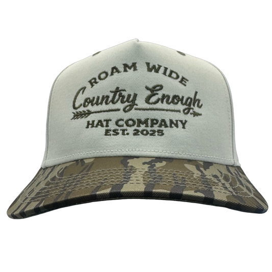 legacy heritage snapback with graphic of arrow and words roam wide, country enough hat company est. 2025 #bottomland