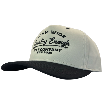 legacy heritage snapback with graphic of arrow and words roam wide, country enough hat company est. 2025 #black