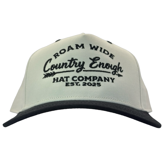 legacy heritage snapback with graphic of arrow and words roam wide, country enough hat company est. 2025 #black