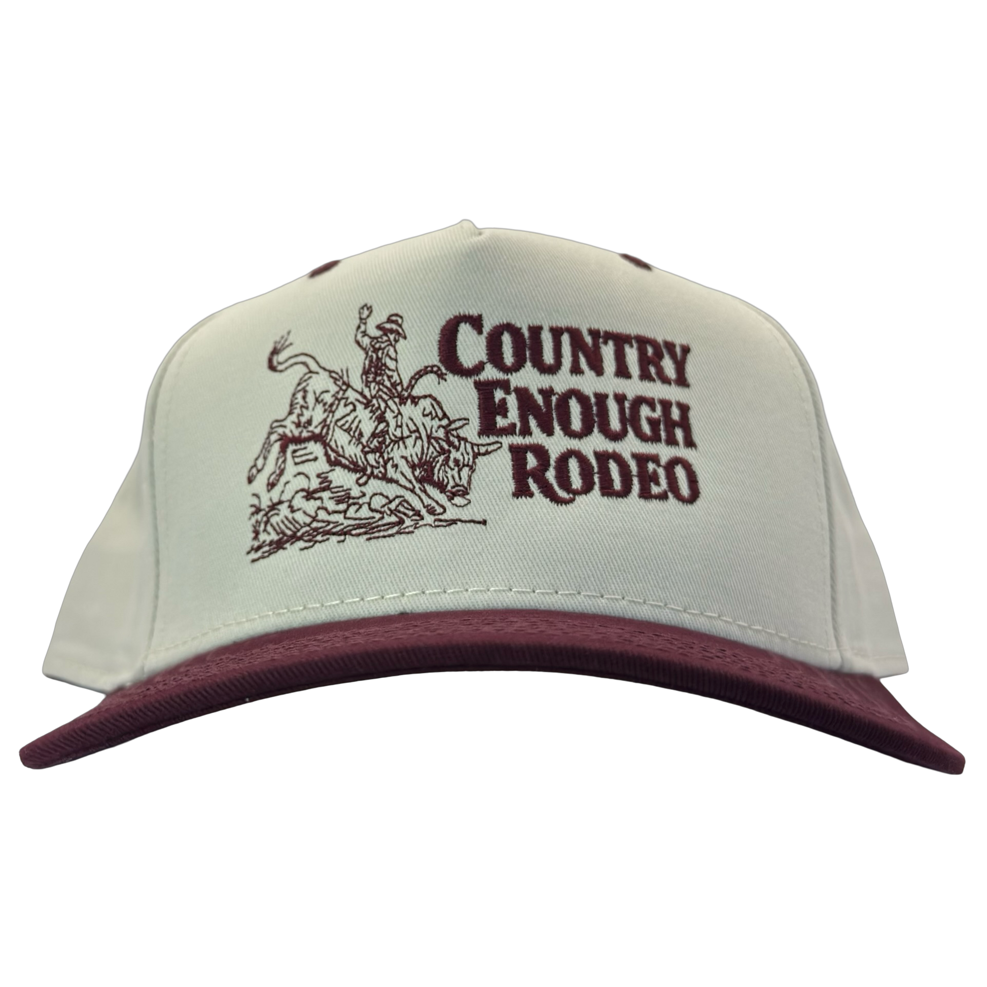 Legacy heritage snapback hat with graphic of bull rider on a bucking bull and the words country enough rodeo #wine