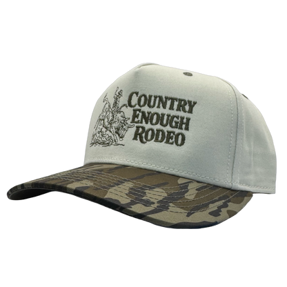 Legacy heritage snapback hat with graphic of bull rider on a bucking bull and the words country enough rodeo #bottomland
