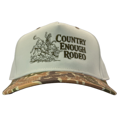 Legacy heritage snapback hat with graphic of bull rider on a bucking bull and the words country enough rodeo #duckcamo